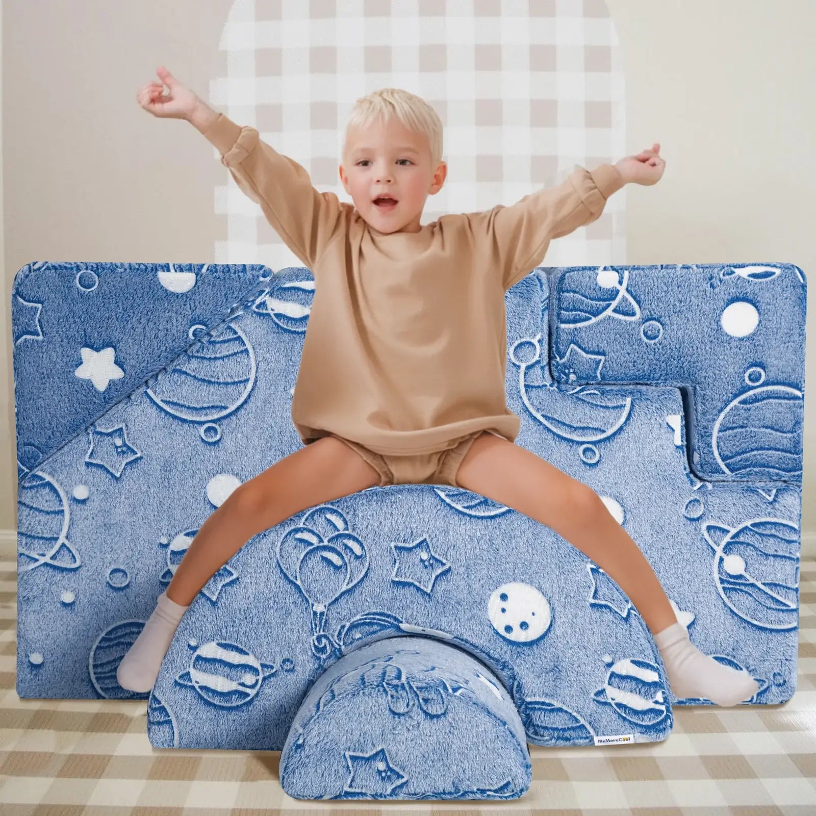 Boy sits and plays on Glowsofa's Space Astronaut Climbing Kids Play Couch