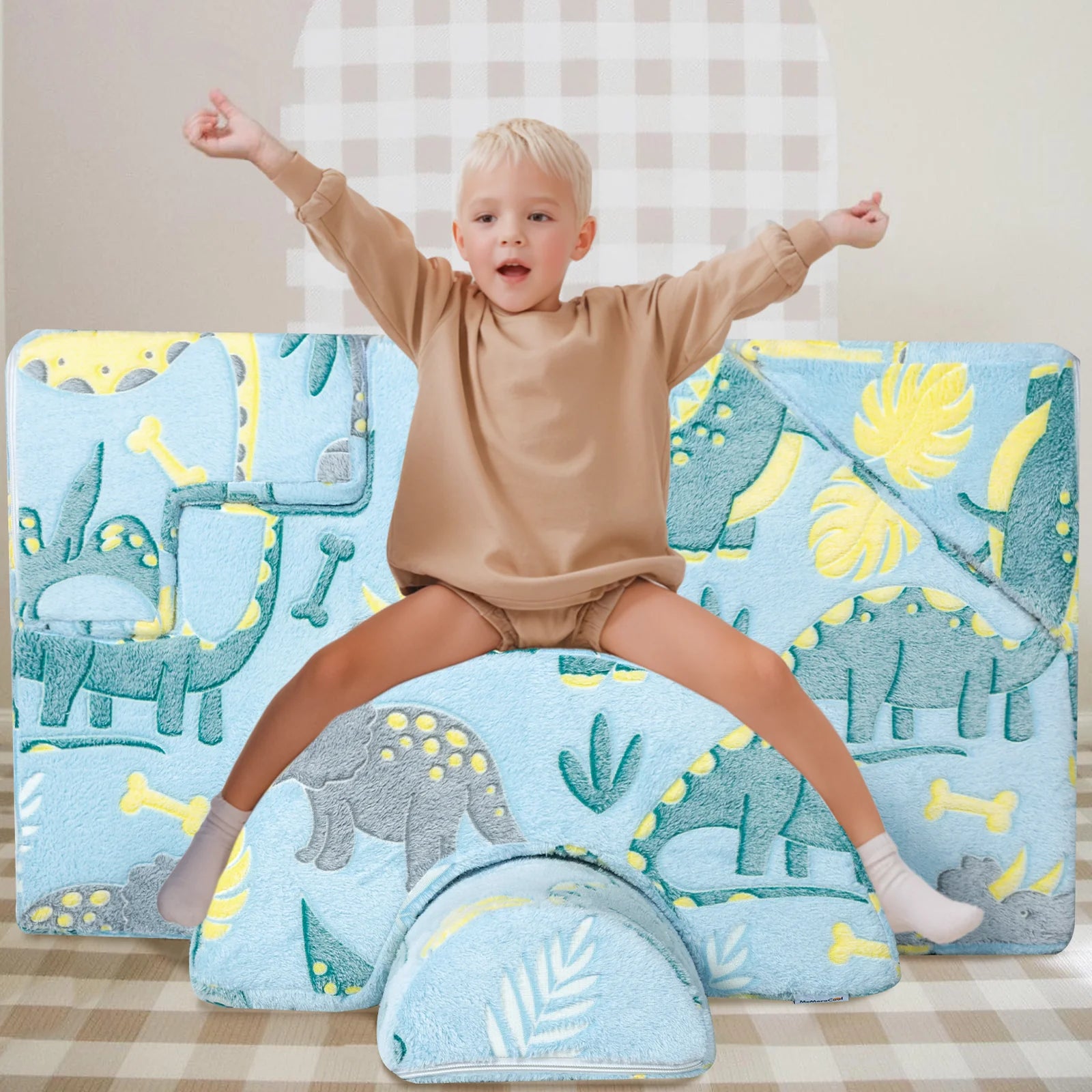 Boy sits and plays on Glowsofa's Blue Dinosaur Climbing Kids Play Couch