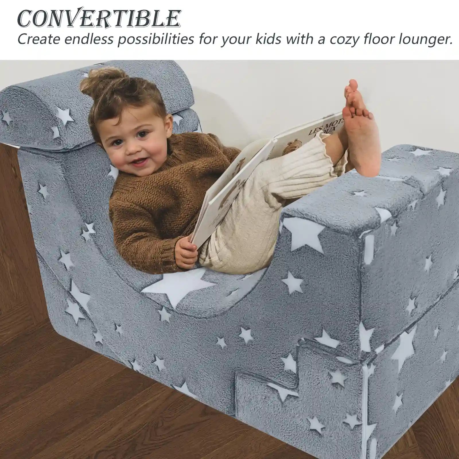 Child lying on the floor lounger made up of Glowsofa's Glowing Star Climbing Kids Play Couch
