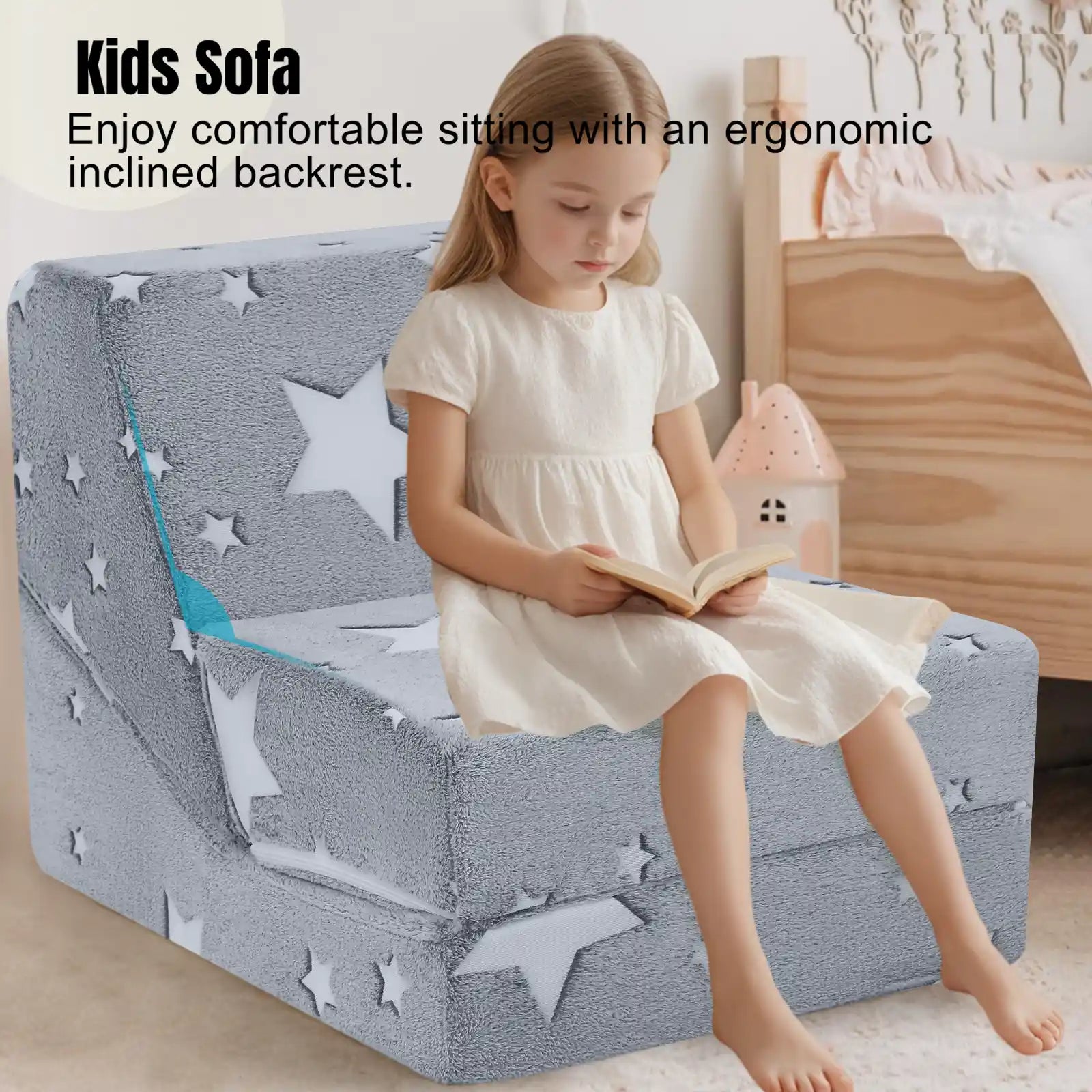Girl sitting on ergonomically designed Glowsofa's Glowing Star Children's Fold Out Sofa