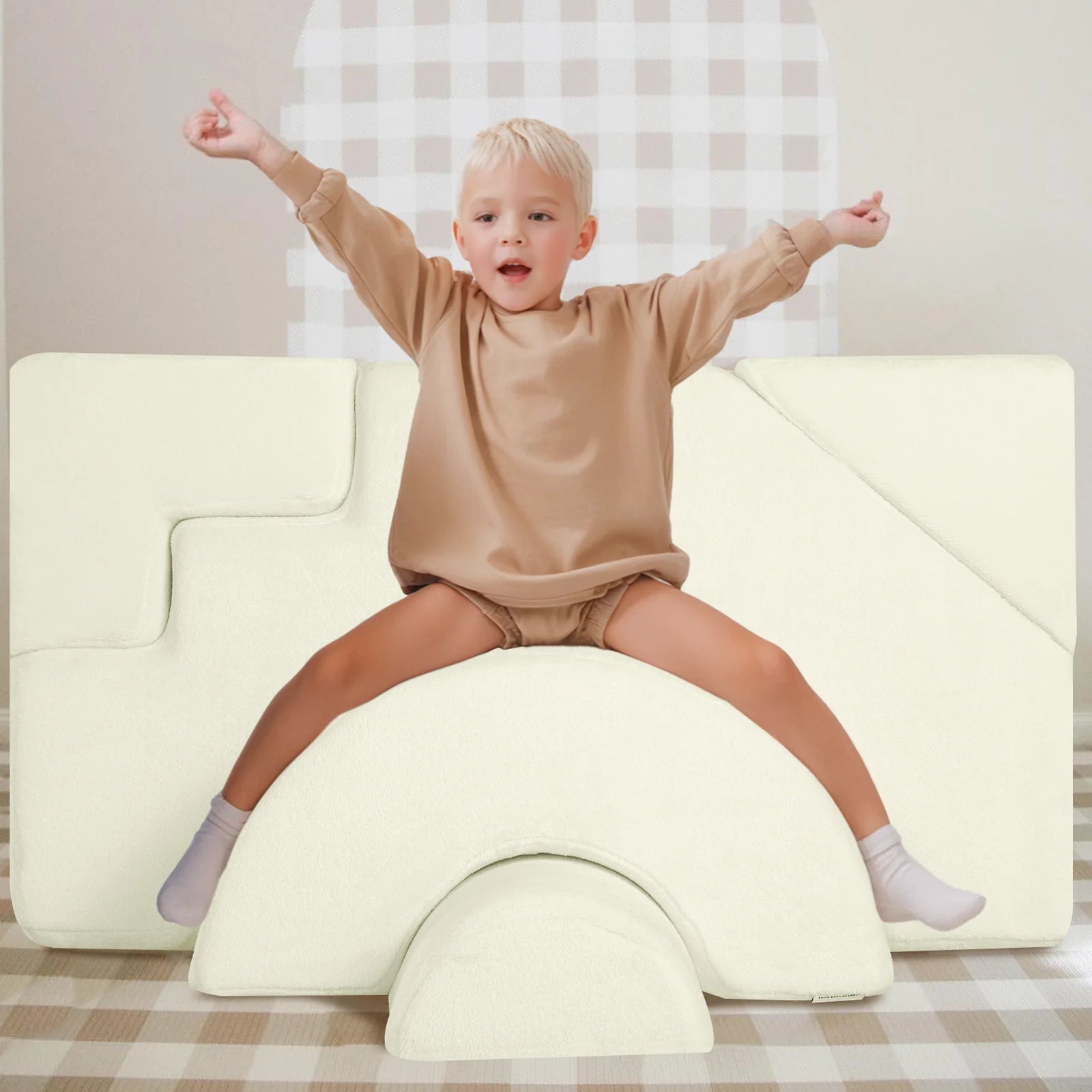 Boy sits and plays on Glowsofa's Solid Beige Climbing Kids Play Couch
