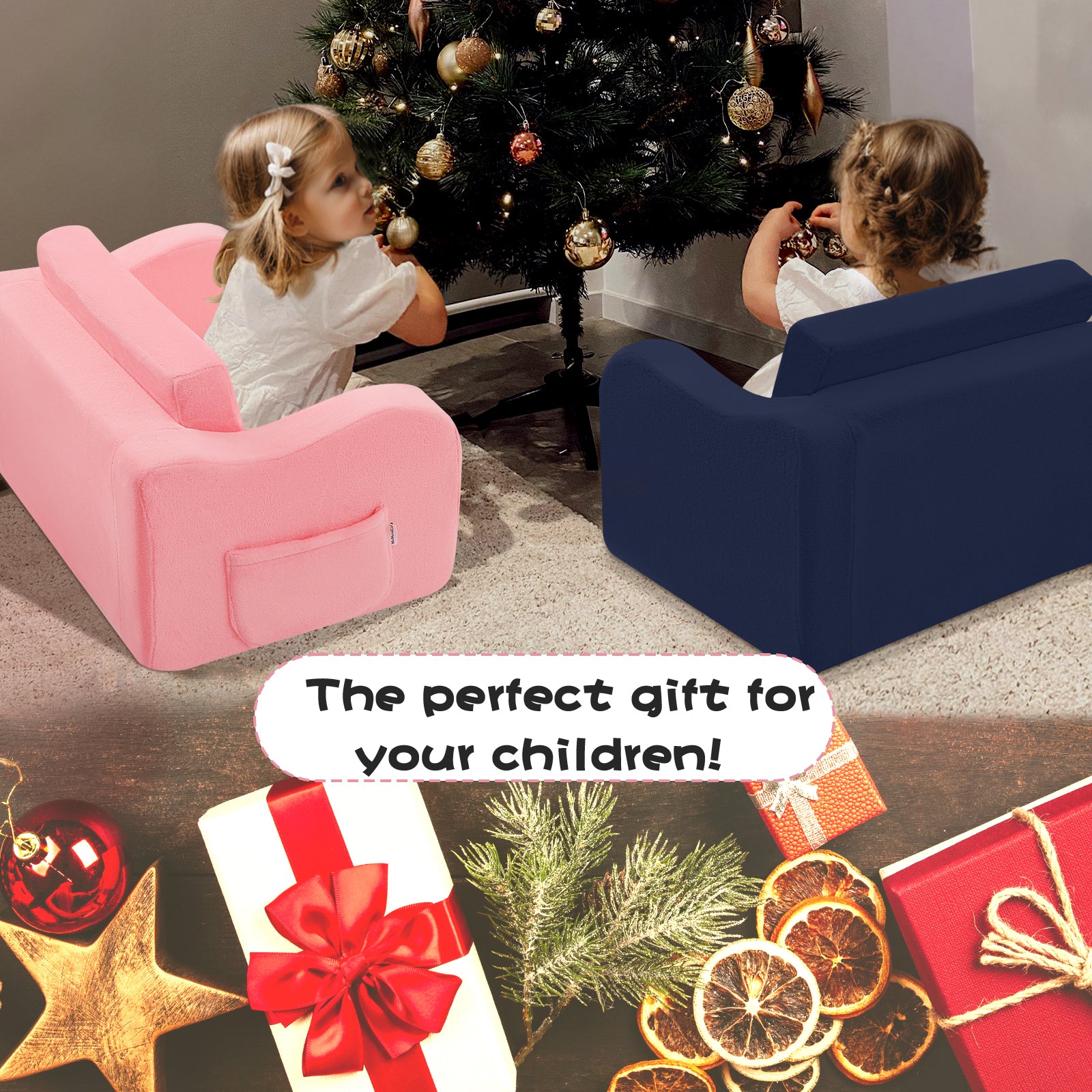Two girls sitting on Navy Glowsofa's children's couch chair and Pink Glowsofa's children's couch chair in front of the Christmas tree.