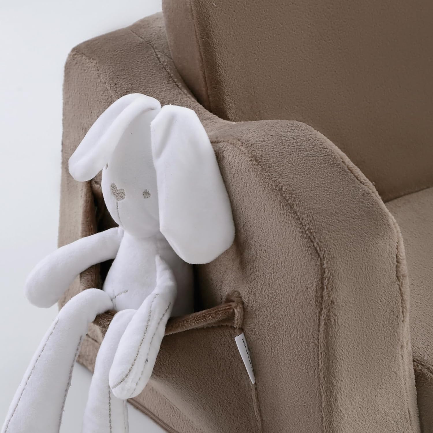 Glowsofa's Brown Children's Fold Out Sofa features pockets on the sides.