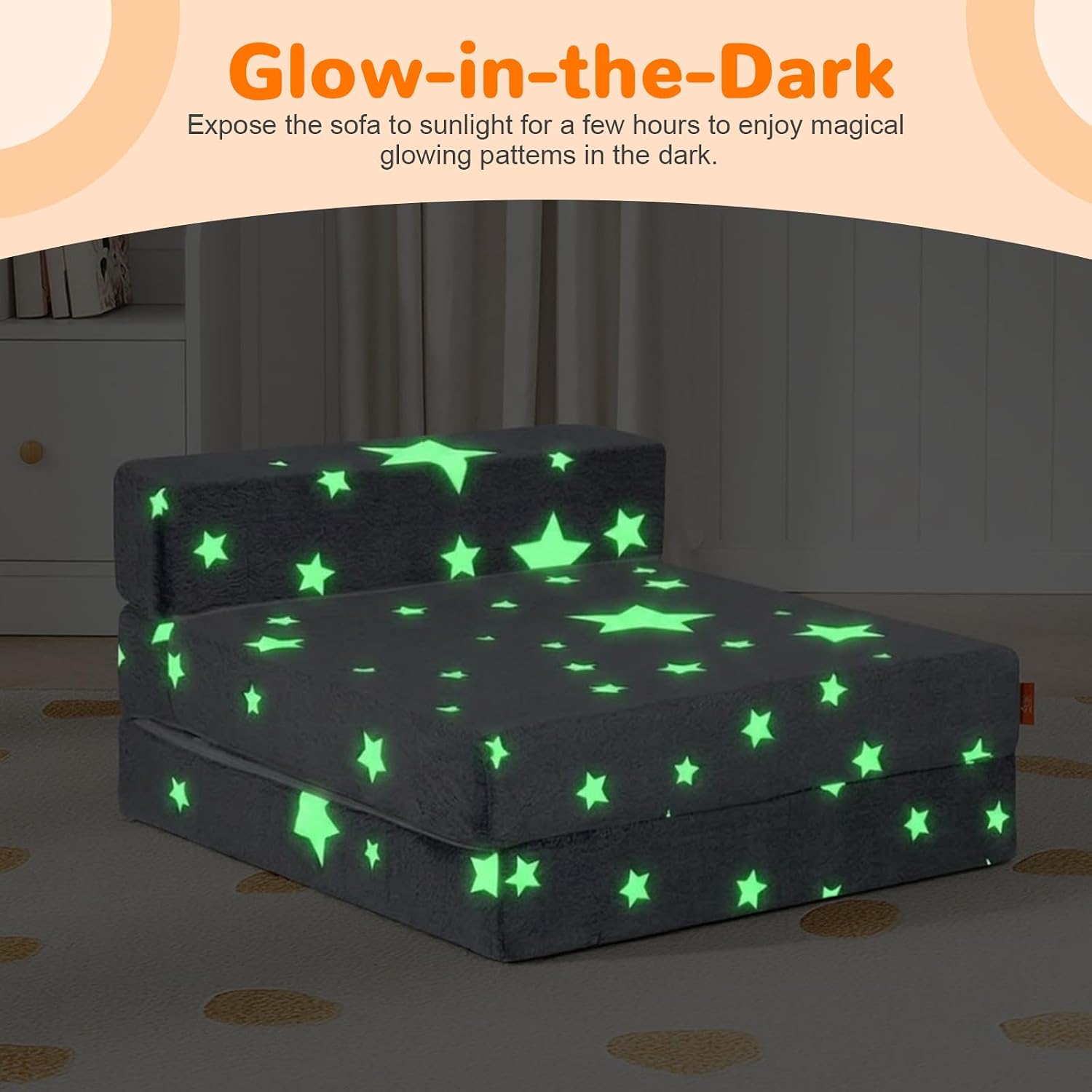 Glow Tri-Fold play couch glowing in the dark — star print lights up when the room goes dark