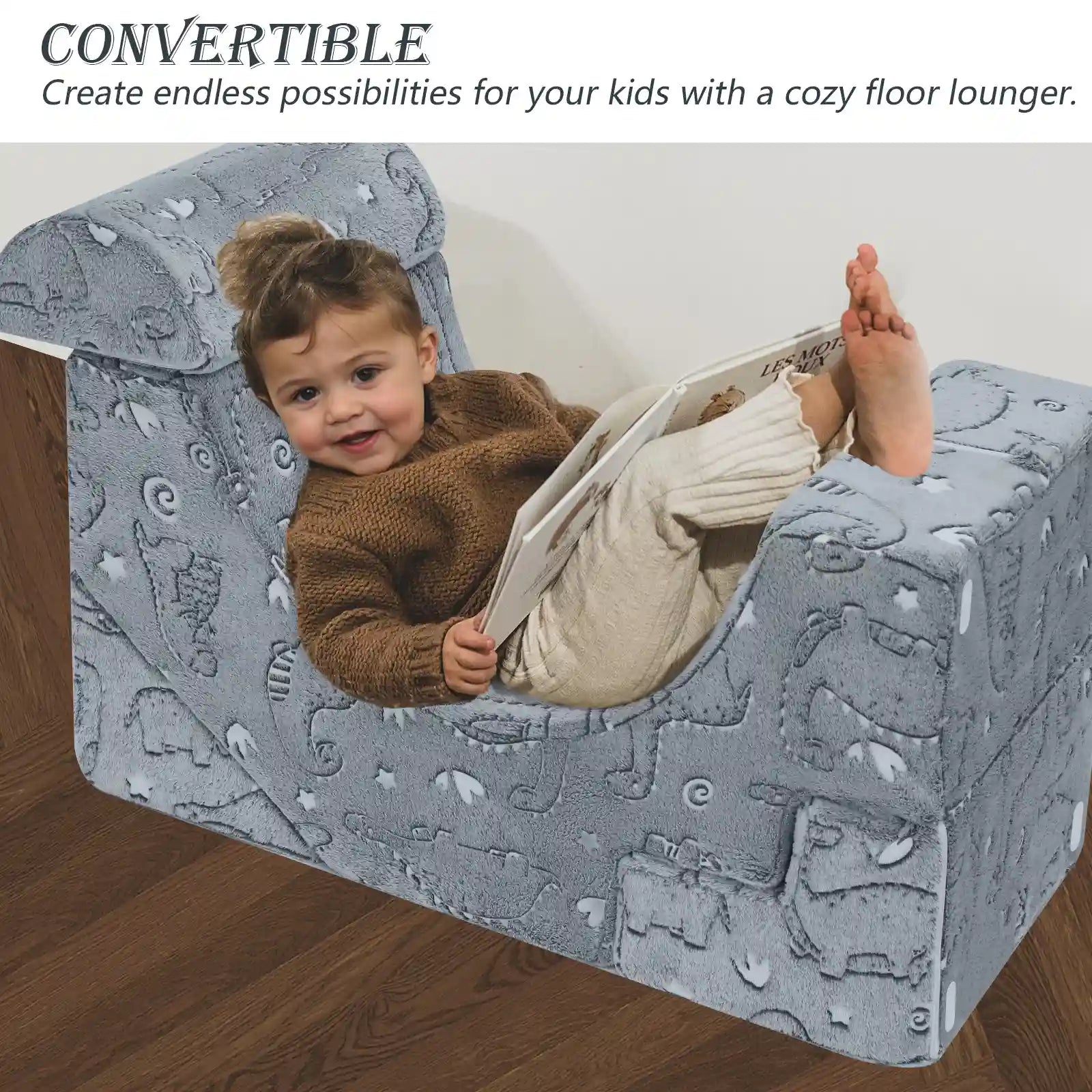 Child lying on the floor lounger made up of Glowsofa's Glowing Dinosaur Climbing Kids Play Couch