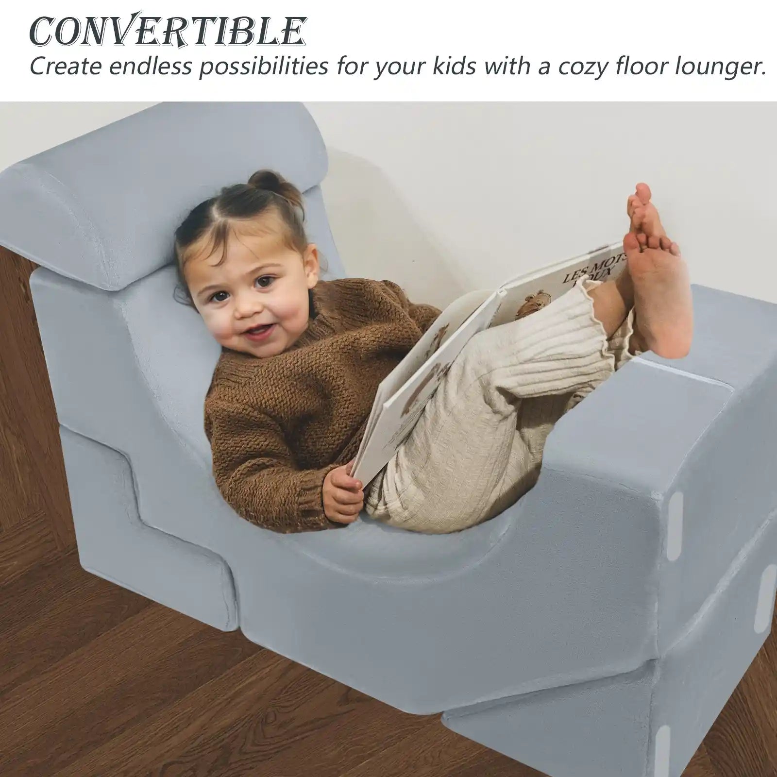 Child lying on the floor lounger made up of Glowsofa's Solid Grey Climbing Kids Play Couch