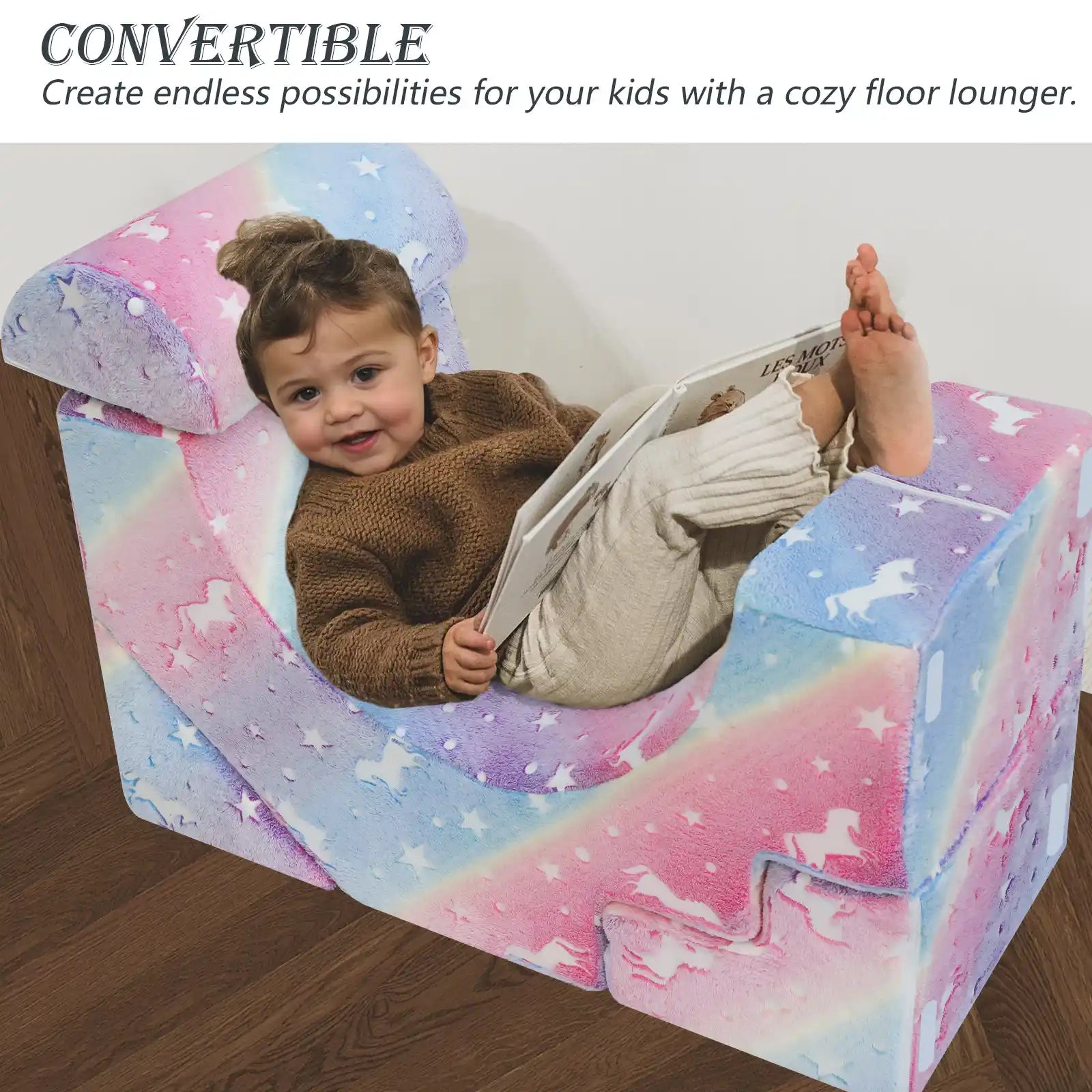 Child lying on the floor lounger made up of Glowsofa's Glowing Rainbow Climbing Kids Play Couch