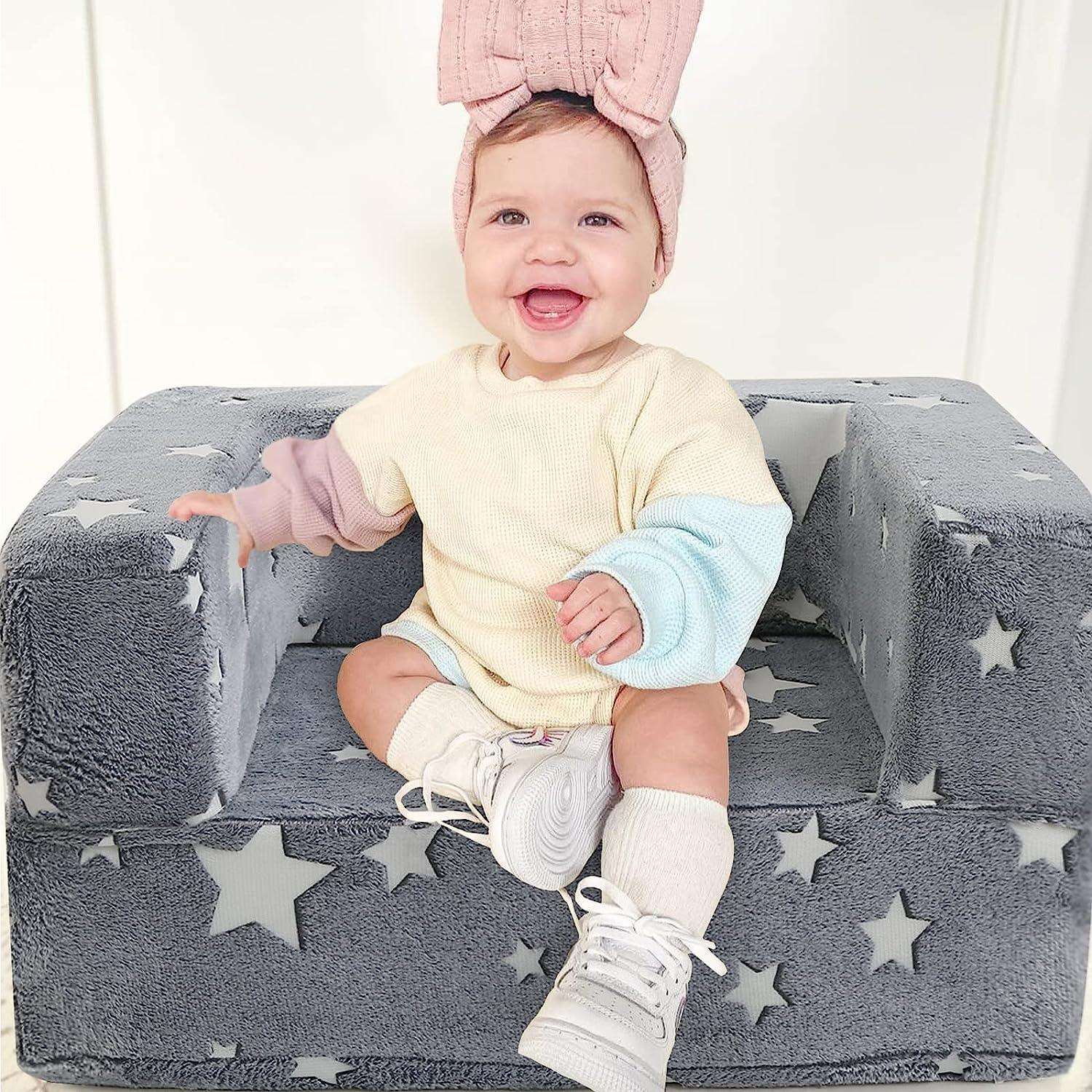 A child sitting on the Toddler Chair