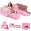 Girl sitting on glowing colorful unicorn fabric kids play couch