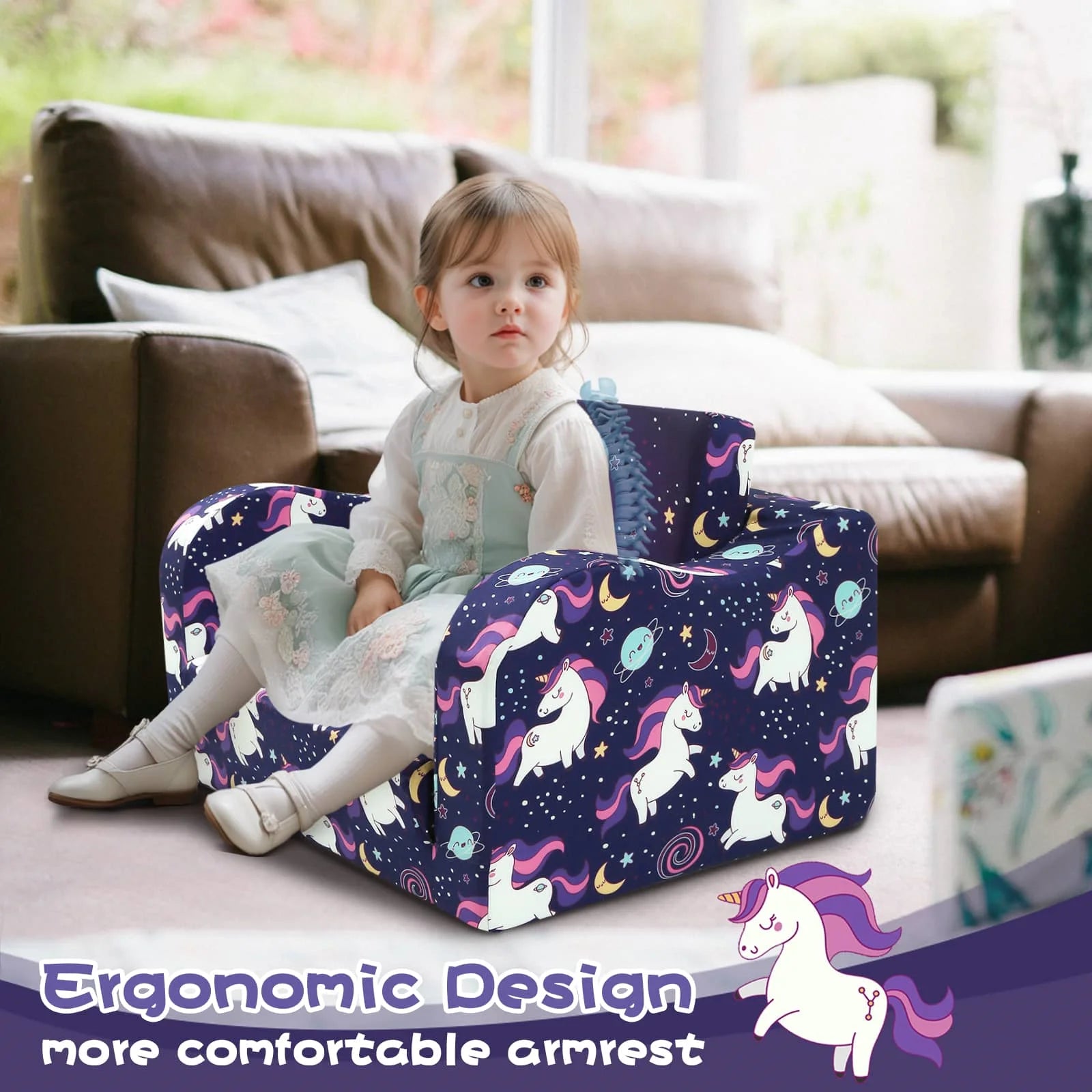 Girl sitting on Glowsofa's children's couch chair with Unicorn patterns with armrests 