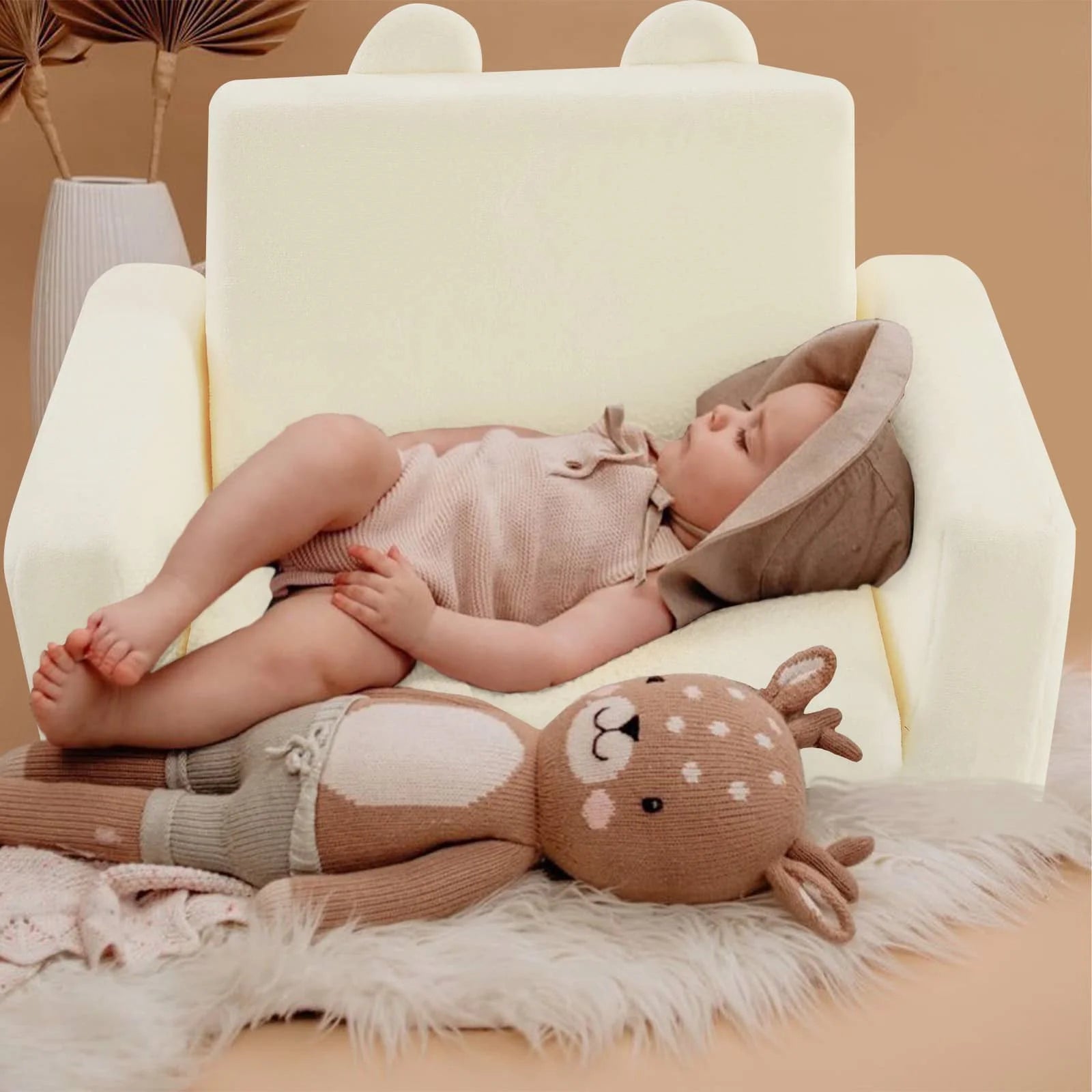 Little boy lying on Children's fold out sofa-Beige