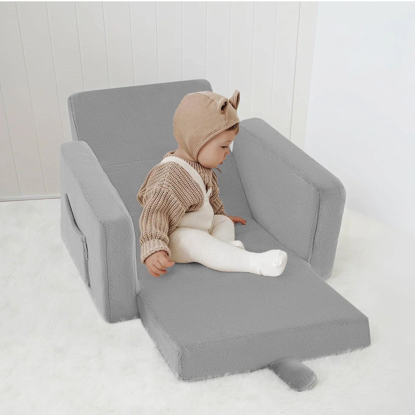 Little boy sitting on Children's fold out sofa-Grey