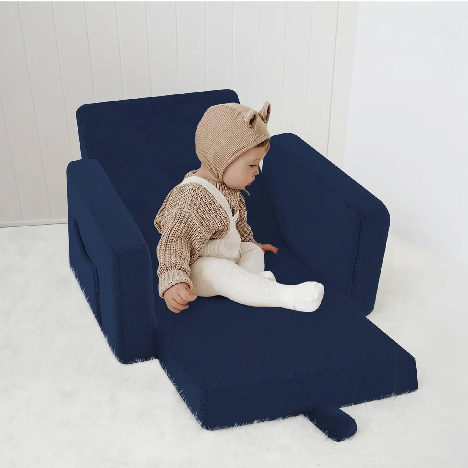 Little boy sitting on Children's fold out sofa-Navy