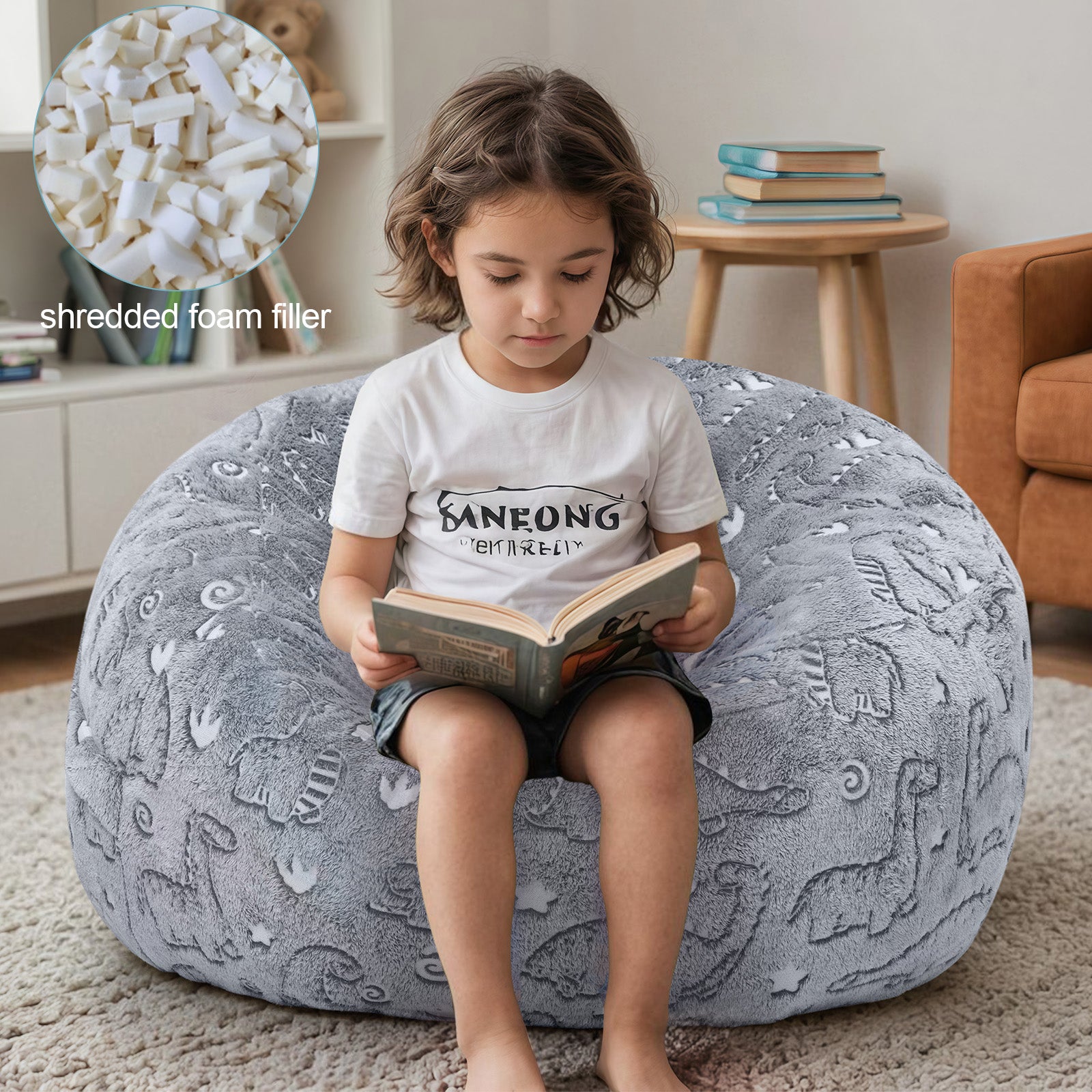 Boy reads a book while sitting on Comax's Glowing Dinosaurs Bean Bag Chair for kids, padded with shredded foam.