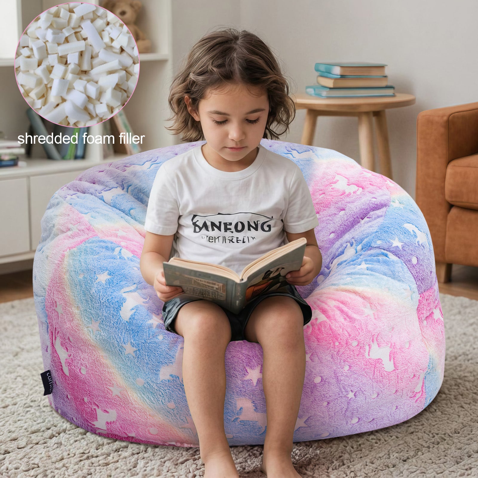 Boy reads a book while sitting on Comax's Glowing Rainbow Bean Bag Chair for kids, padded with shredded foam.