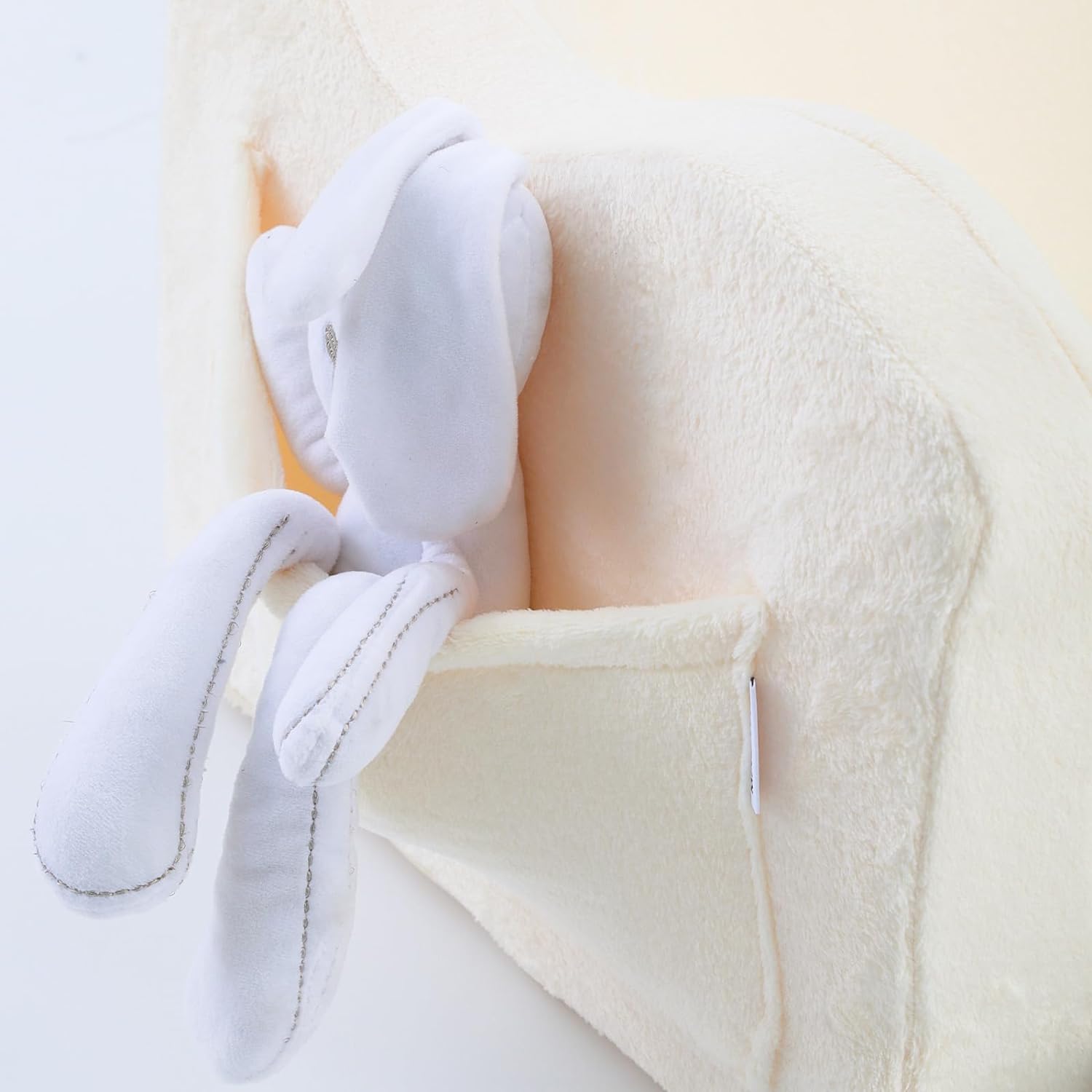 Glowsofa's Cream Children's Fold Out Sofa features pockets on the sides.