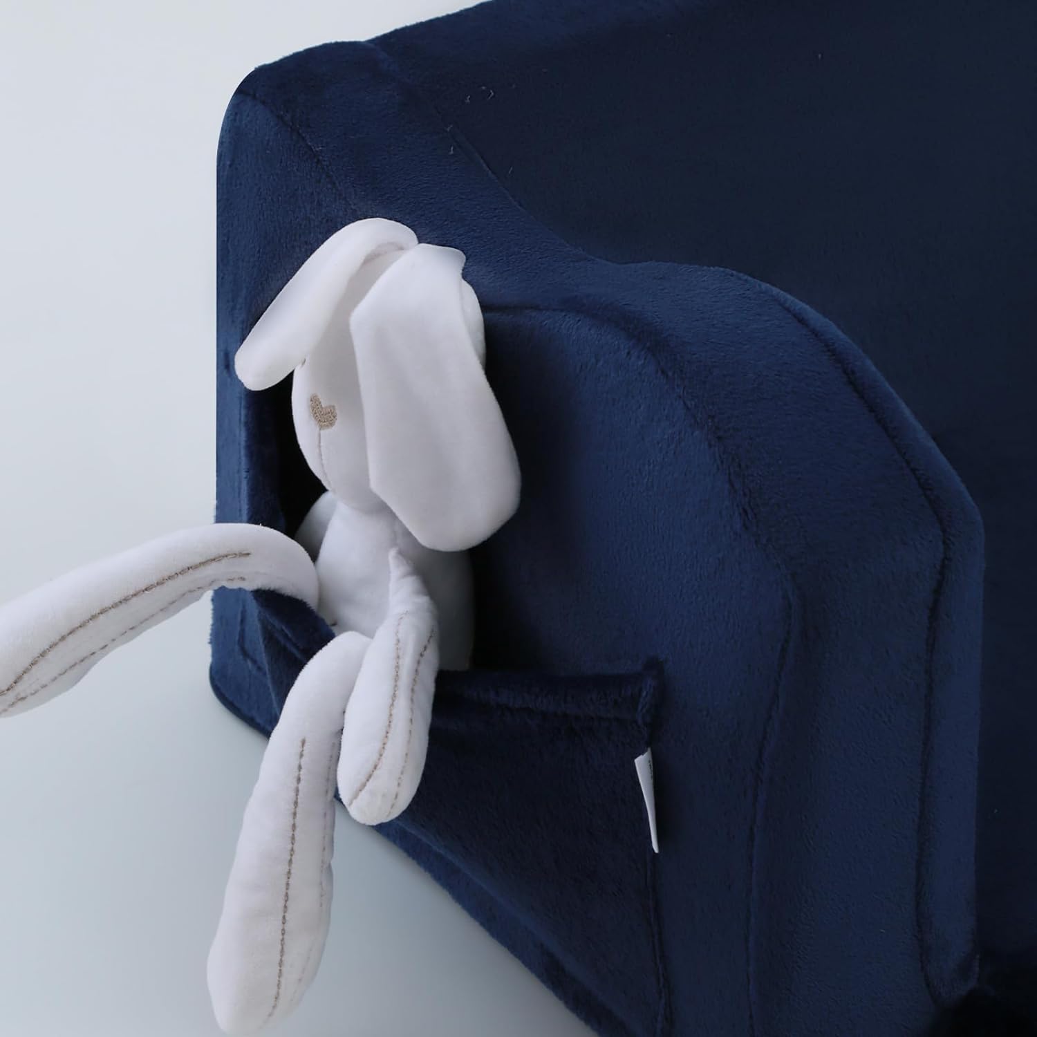 Glowsofa's Navy Children's Fold Out Sofa features pockets on the sides.