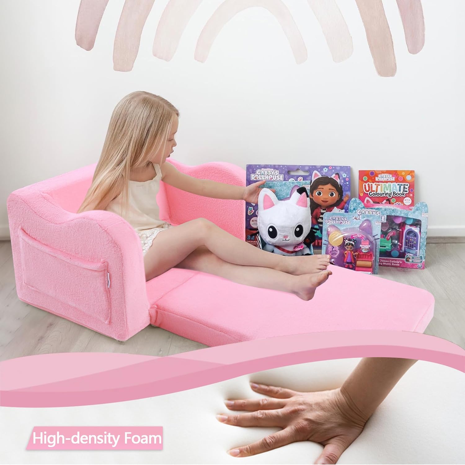 Girl sitting on unfolded Glowsofa's Pink Children's Fold Out Sofa