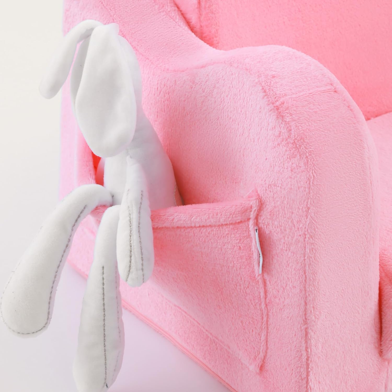 Glowsofa's Pink Children's Fold Out Sofa features pockets on the sides.