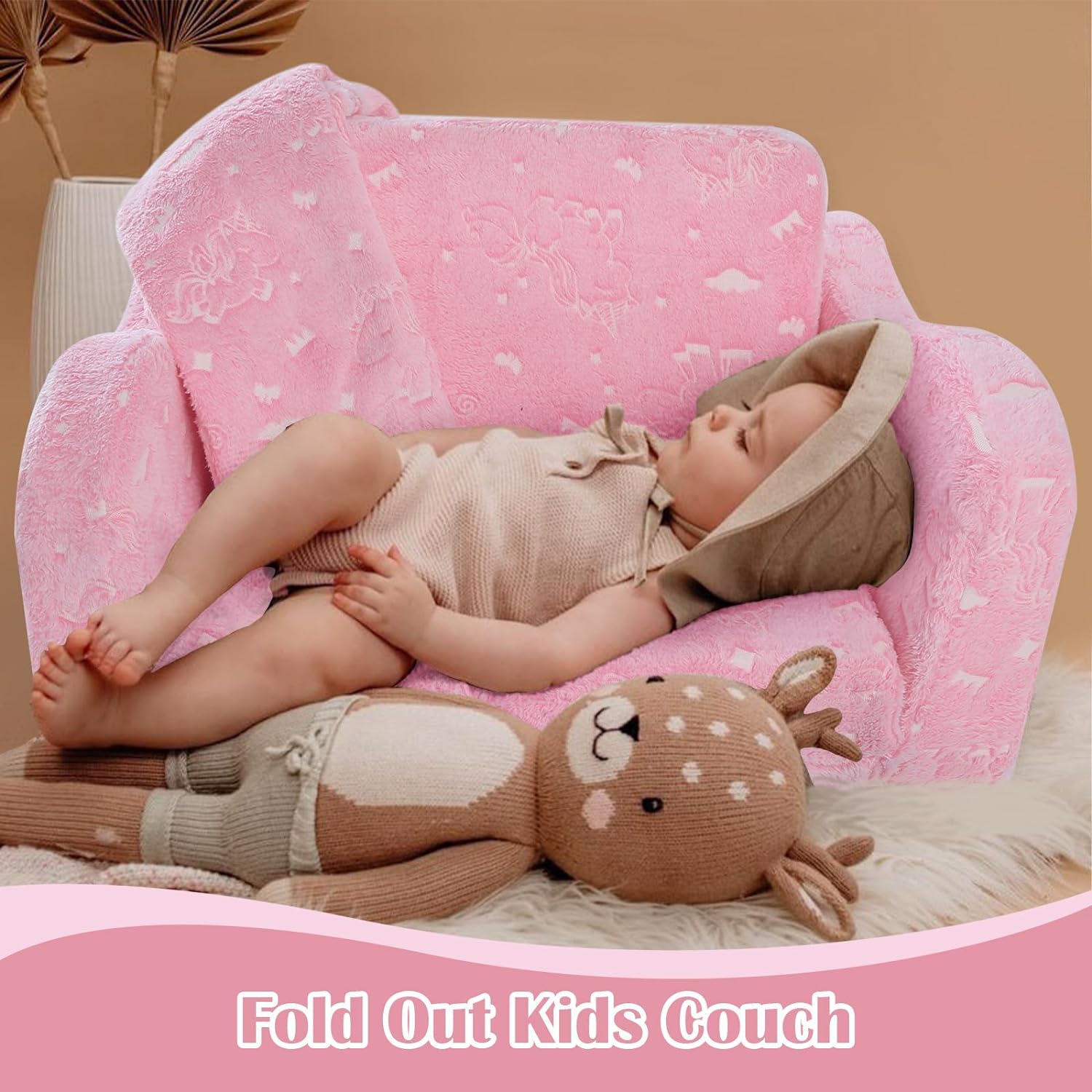Baby lying on Glowsofa's Pink Children's Fold Out Sofa